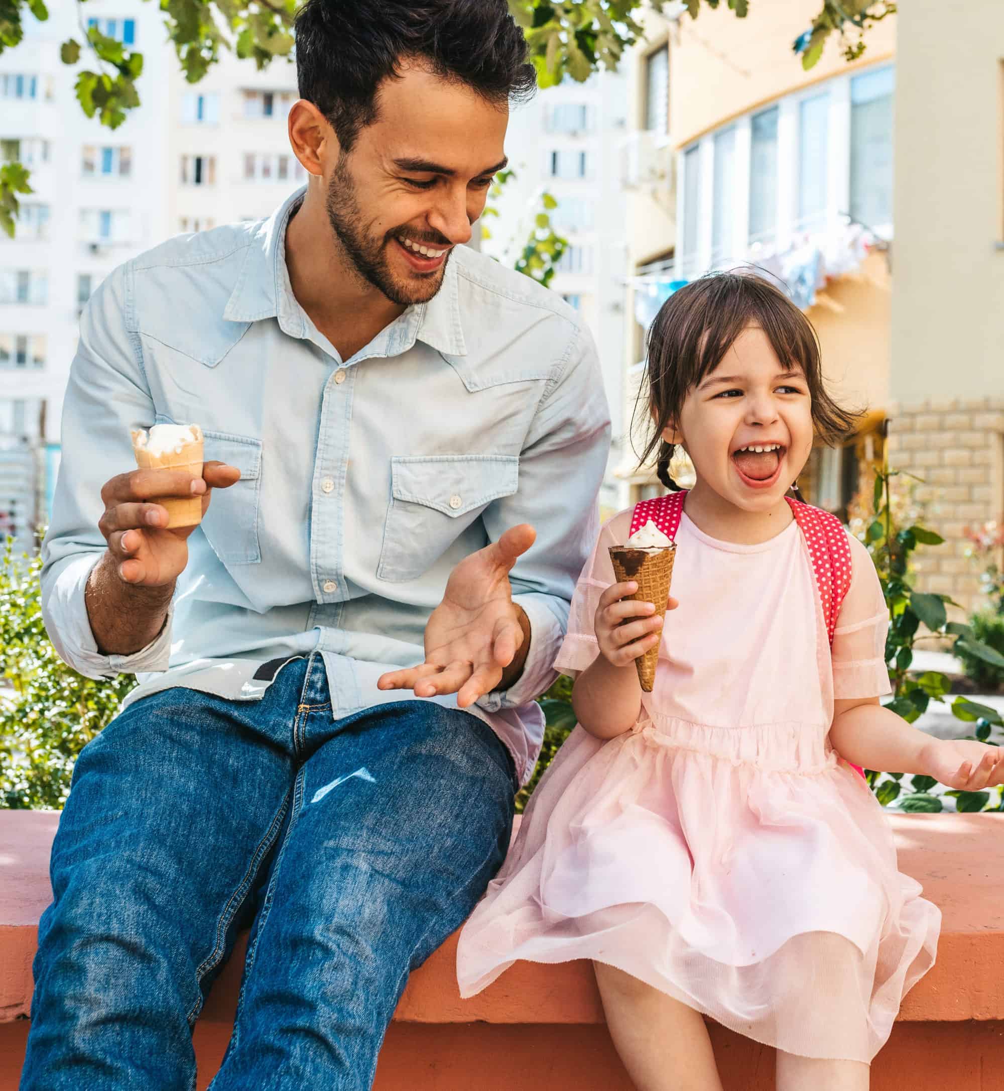 Daddy and daughter enjoy eating two vanilla ice cream cones together in San Marco Dreamette the most delicious ice cream in Jacksonville